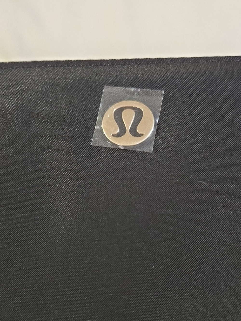 lululemon black clutch with gold logo disc - Picture 2 of 11